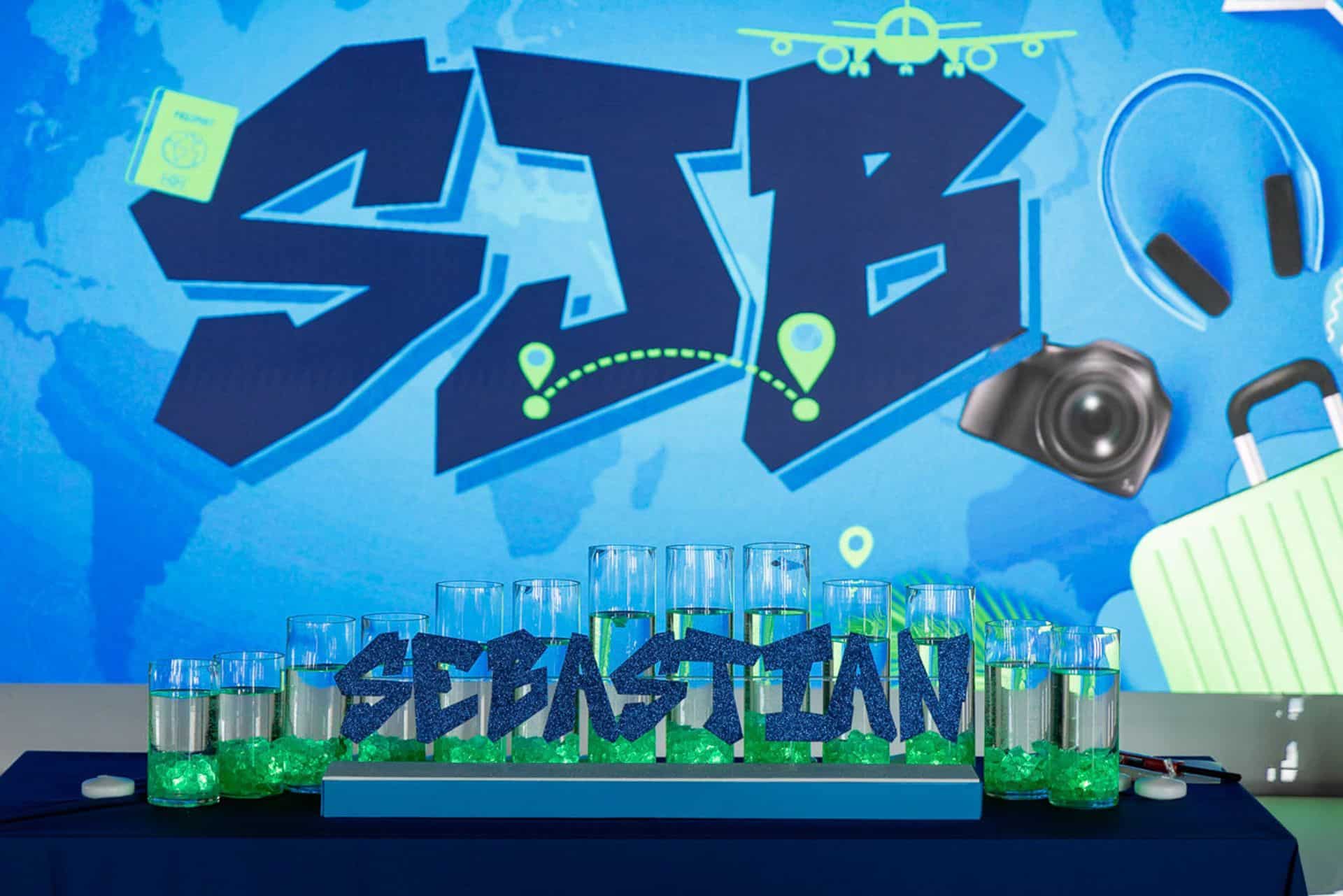 Blue Glitter Candle Lighting Display with Cylinders & Neon Green LED Chips for a Travel Theme Bar Mitzvah