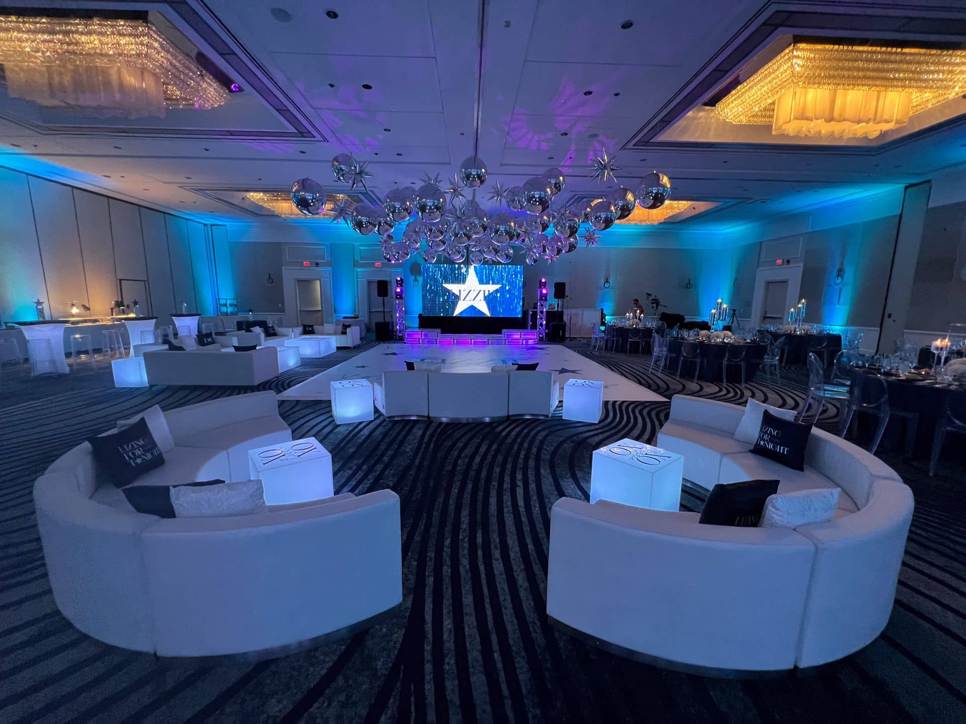 Custom Lounge, Balloon Ceiling with Stars and Metallic Orbs, and Blue Uplighting for a Bat Mitzvah at Hyatt Greenwich