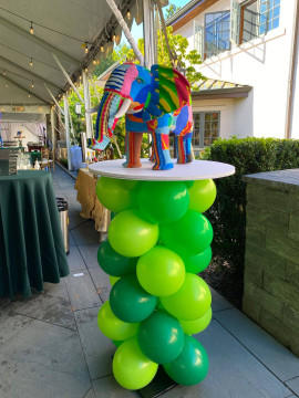 Green Animal Column as Base for Recycled Elephant Centerpiece at a Outdoor Jungle Themed Bar Mitzvah