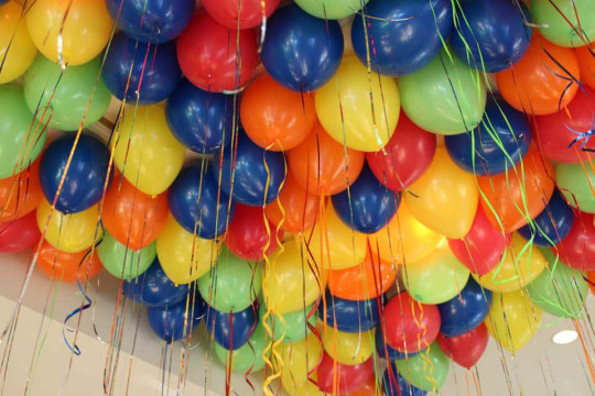 Multi Colored Balloons over Dance Floor with Ribbon