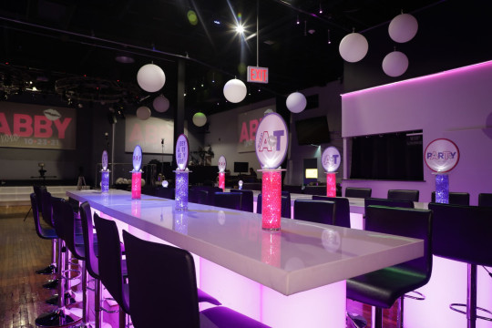 Beautiful Custom LED Pink and Lavender Chips on a Cylinder with Alternating Logo Toppers for Bat Mitzvah High Top Tables Set Up