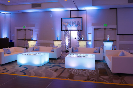 Beautiful and Custom LED Lounge Setup with High Tops, Custom Pillows and Printed Sign Over Balloon Column