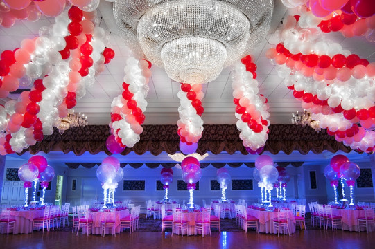 Graduation Party Room with Cluster Balloon Garlands on Ceiling at Anthony's Pier 9