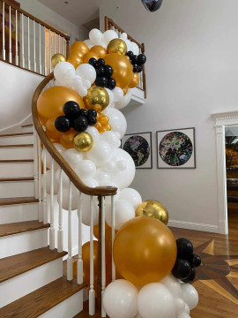 Organic Balloon Garland Over Stairway for House Party Decor