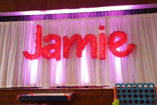 Hot Pink Sculpture Name in Balloons with Lights on LED Curtain