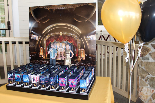 Movie Awards Themed Seating Card Display with Photo Cutouts