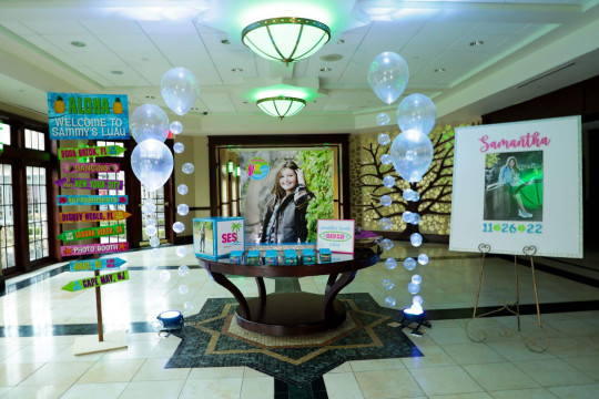 Beach Themed Entrance Decor with Blowup Photo Seating Card Display & Clear Bubble Balloons at Temple Emanu-el Closter