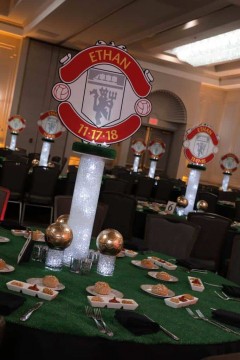 Soccer Themed Logo Centerpieces on LED Aqua Gems Cylinders with Mini Gold Soccer Balls