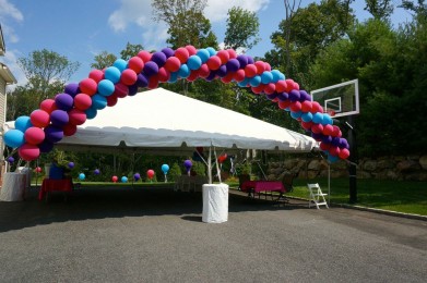 Outdoor First Birthday with Cluster Balloon Arch over Tent