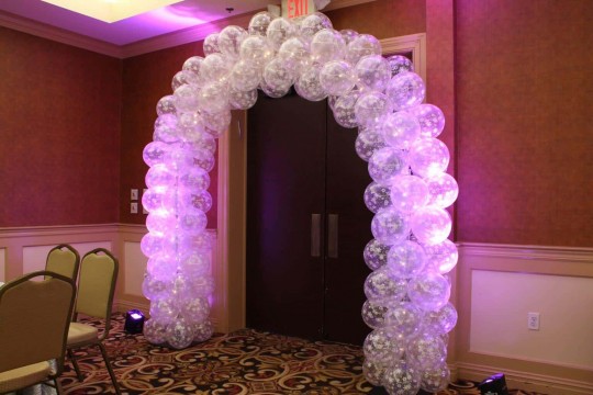 Winter Themed Balloon Arch with Clear Snowflake Balloons & Pink LED Lighting