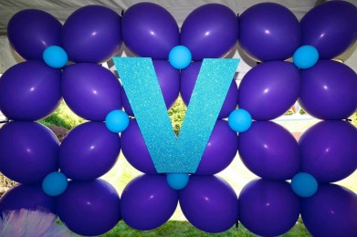 Custom Balloon Wall with Sparkly Initial Behind Candy Bar Display