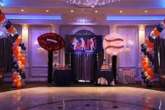 Football & Baseball Balloon Sculptures on Either Side of Custom Logo Backdrop for ESPN Themed Bar Mitzvah at The Rockleigh