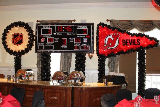 Hockey Themed Bar Mitzvah Scoreboard Backdrop with NJ Devils Pennant & Hockey Puck Balloon Sculptures