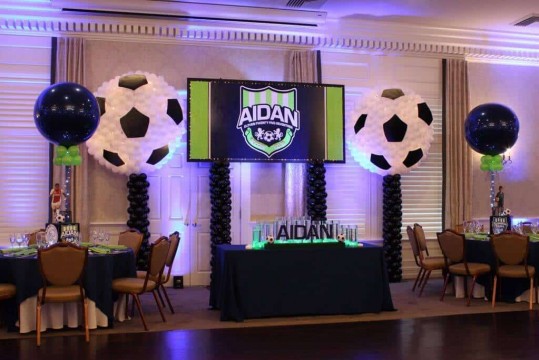 Soccer Ball Balloon Sculptures Near Custom Logo Backdrop for Sports Themed Bar Mitzvah