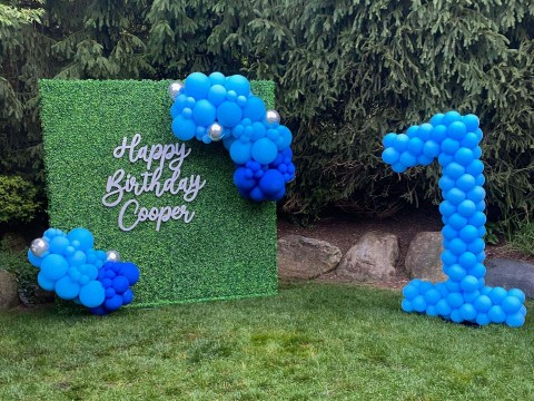 Number 1 Balloon Sculpture and Greenery Wall with Signage for First Birthday