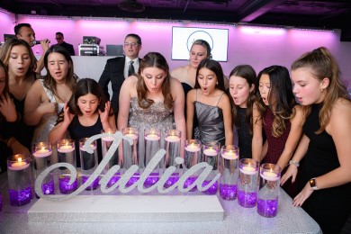 Silver Candle Lighting Display with Cylinders and Floating Candles for Bat Mitzvah