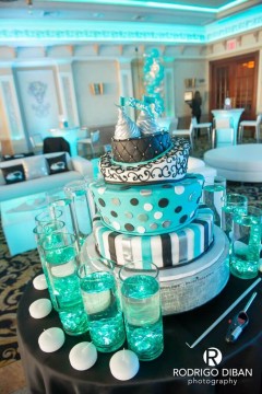 Turquoise LED Cylinders Around Cake for Candle Lighting