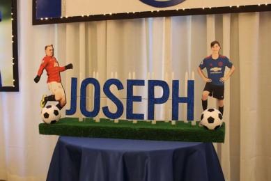 Soccer Themed Candle Lighting Display with Player Cutouts and Soccer Balls