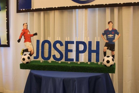 Soccer Themed Candle Lighting Display with Player Cutouts and Soccer Balls
