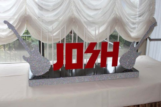 Music Themed Candle Lighting Display with Glittered Guitar Cutouts