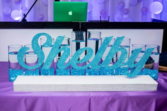 Turquoise Glitter Name Display with Turquoise LED Cylinders for Bat Mitzvah Candle Lighting