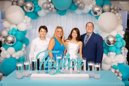 Turquoise Candle Lighting Display with Cylinders, Floating Candles and Beautiful Organic Balloon Arch for Outdoor Bat Mitzvah