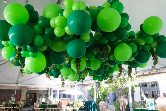 Jungle Themed Ceiling Greenery Balloon Garland with Life Size Animal Cut Outs and Custom Printed Signs for Outdoor Bar Mitzvah Decor