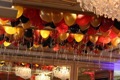 Red, Black & Gold Ceiling Balloons with Shimmer Ribbon on Ceiling at Seasons