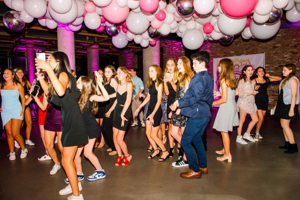 Amazing Shades of Pink Balloon Garland with Silver Metallic Orbz Accent over Dance Floor Ceiling and Custom Step and Repeat for Bat Mitzvah Decor