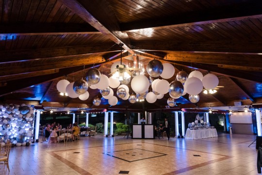 Classic Balloon Ceiling Treatment with Large White Balloons and Silver Metallic Orbz and Black and White Organic Balloon Wall for Bat Mitzvah Decor