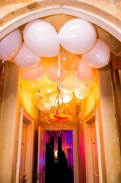 White and Clear Hanging Ceiling Balloons on Entrance as Accent Decor for Wedding