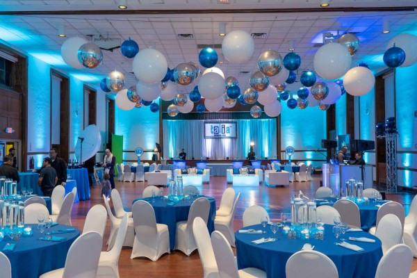 Blue Bat Mitzvah Party Room with Ceiling Balloon Treatment, LED Centerpieces and Custom Lounge at Temple Israel Center, White Plains