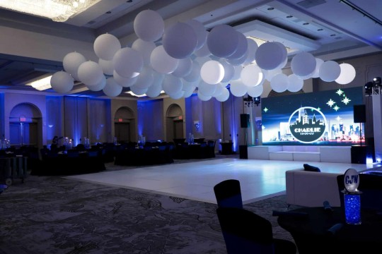 Large White Ceiling Balloon Install over Dance Floor for NYC Themed Bar Mitzvah at the Park Ridge Marriott