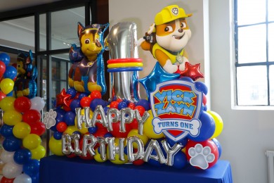 Paw Patrol Themed Fancy Balloon Bouquet with Custom Sign and Paw Prints for First Birthday Party