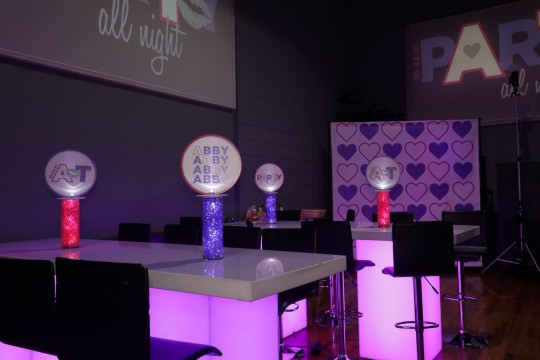 Beautiful LED Logo Topper Centerpiece, with Alternating Logos over Cylinders with Aqua Gems for High Top Table Set Up