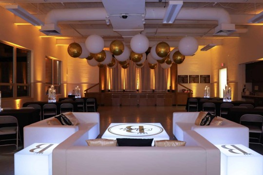 Sweet Sixteen Lounge with Custom Furniture, White & Gold Ceiling Balloons & Amber Uplighting