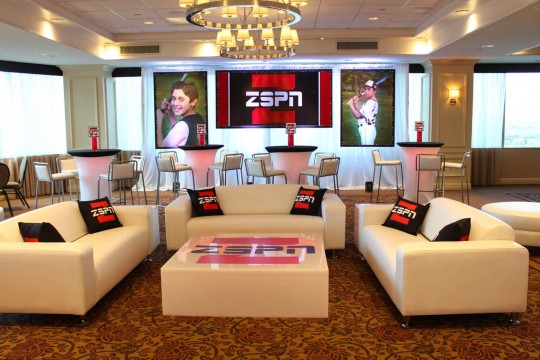 ESPN Themed Lounge Setup with Custom Furniture, LED Tables with Logo Decals, Pillows, Centerpieces & Logo Backdrop at the Mahwah Sheraton