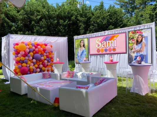 Custom Lounge Furniture with Custom Pillows, Organic Balloon Wall. Custom Backdrop and Blow Up Pictures for Outdoor Tent Party