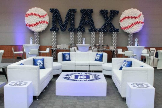 Yankees Themed Lounge with Custom Pillows, Logo Decals & Name in Balloons with Baseball Sculptures