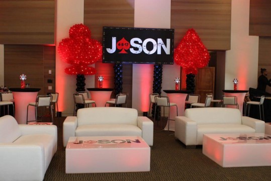 Casino Themed Bar Mitzvah Lounge with LED Furniture, Custom Logo Backdrop and Heart & Spade Balloon Sculpture at Westchester Reform Temple