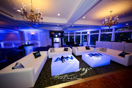 Tennis Themed Bar Mitzvah Lounge with Custom Logo Tables, Pillows & Backdrop at Scarsdale Golf Club