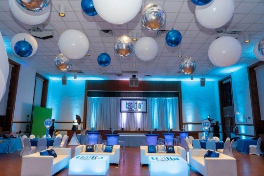 Blue LED Lounge Setup with Custom Logo Tables, Pillows & Backdrop on Pipe & Drape at TIC, White Plains
