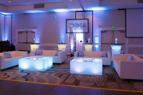 Beautiful and Custom LED Lounge Setup with High Tops, Custom Pillows and Printed Sign Over Balloon Column