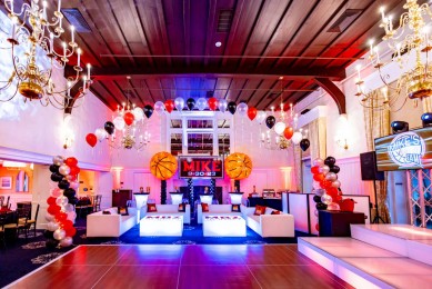Basketball Themed Bar Mitzvah Lounge with Custom LED Tables, LED Highboys & Backdrop with Basketball Balloon Sculptures at Plainfield Country Club