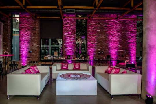 Custom Lounge Furniture for Bat Mitzvah Decor with Pink Uplighting, Custom Logo Pillows, Custom Coffee Table and Couches