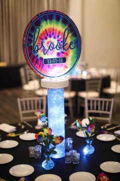 Tie Dye Logo Centerpieces on LED Vases with Gems accented with Tie Dye Roses