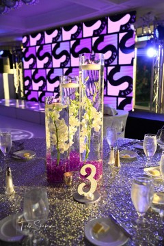 Orchid Centerpiece with Purple Chips & Floating Candles