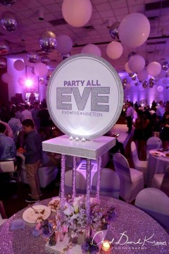 Custom LED Logo Centerpiece with Glittered Border & Floral Accents from Monica Chimes Floral
