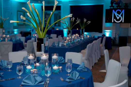 Floral  Calla Lily Centerpiece with Turquoise LED Cylinders and Floating Candles at Tamarack Country Club