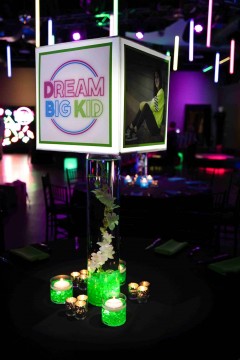 Neon Lampshade Centerpiece on LED Cylinder with Orchids & Lime Green Chips